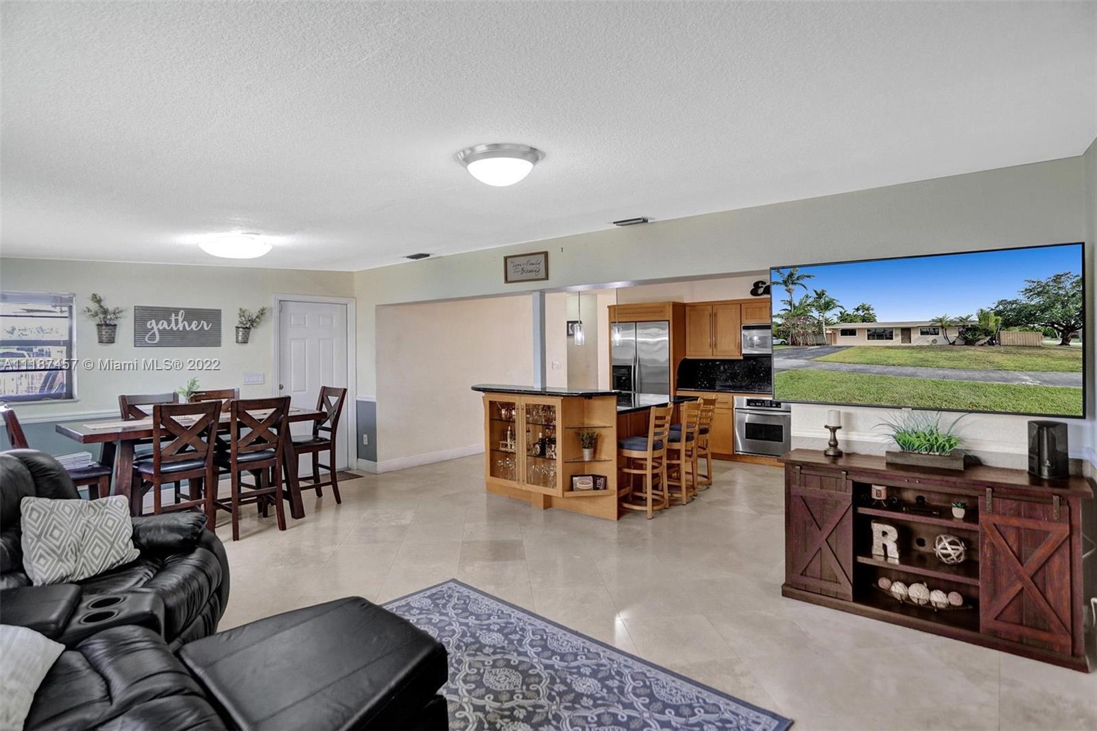 10401 Southwest 53rd Street Miami, FL 33165 - Photo 34 of 53 a dining room with furniture and a large window
