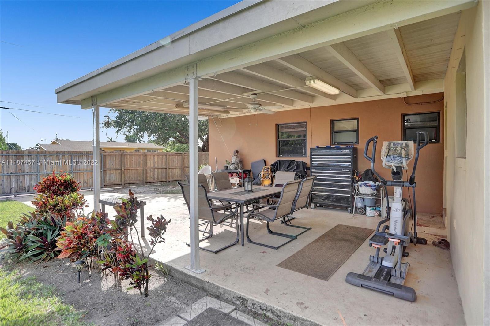 10401 Southwest 53rd Street Miami, FL 33165 - Photo 44 of 53 a view of a patio with table and chairs and potted plants