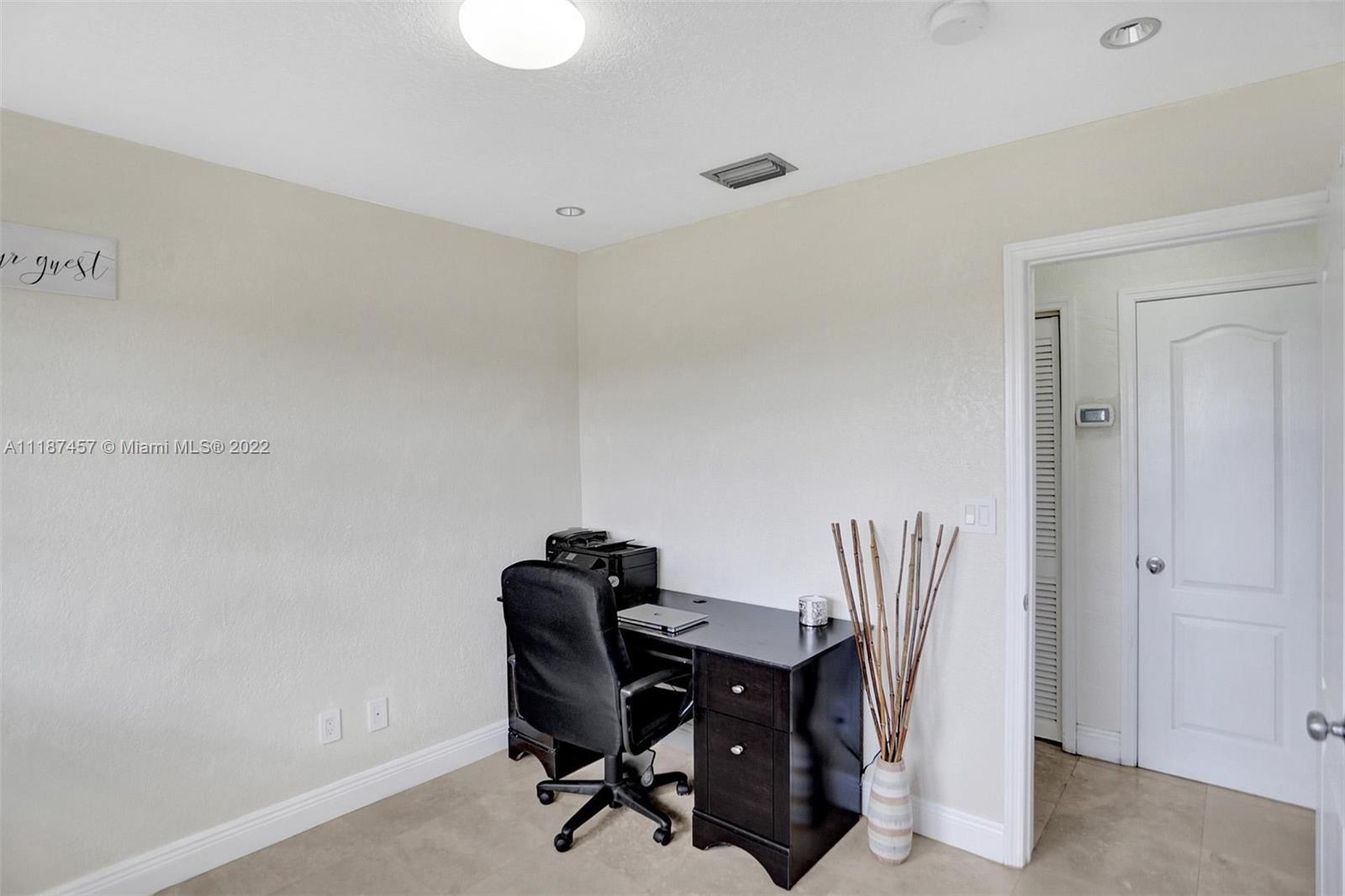 10401 Southwest 53rd Street Miami, FL 33165 - Photo 47 of 53 a view of a workspace with furniture