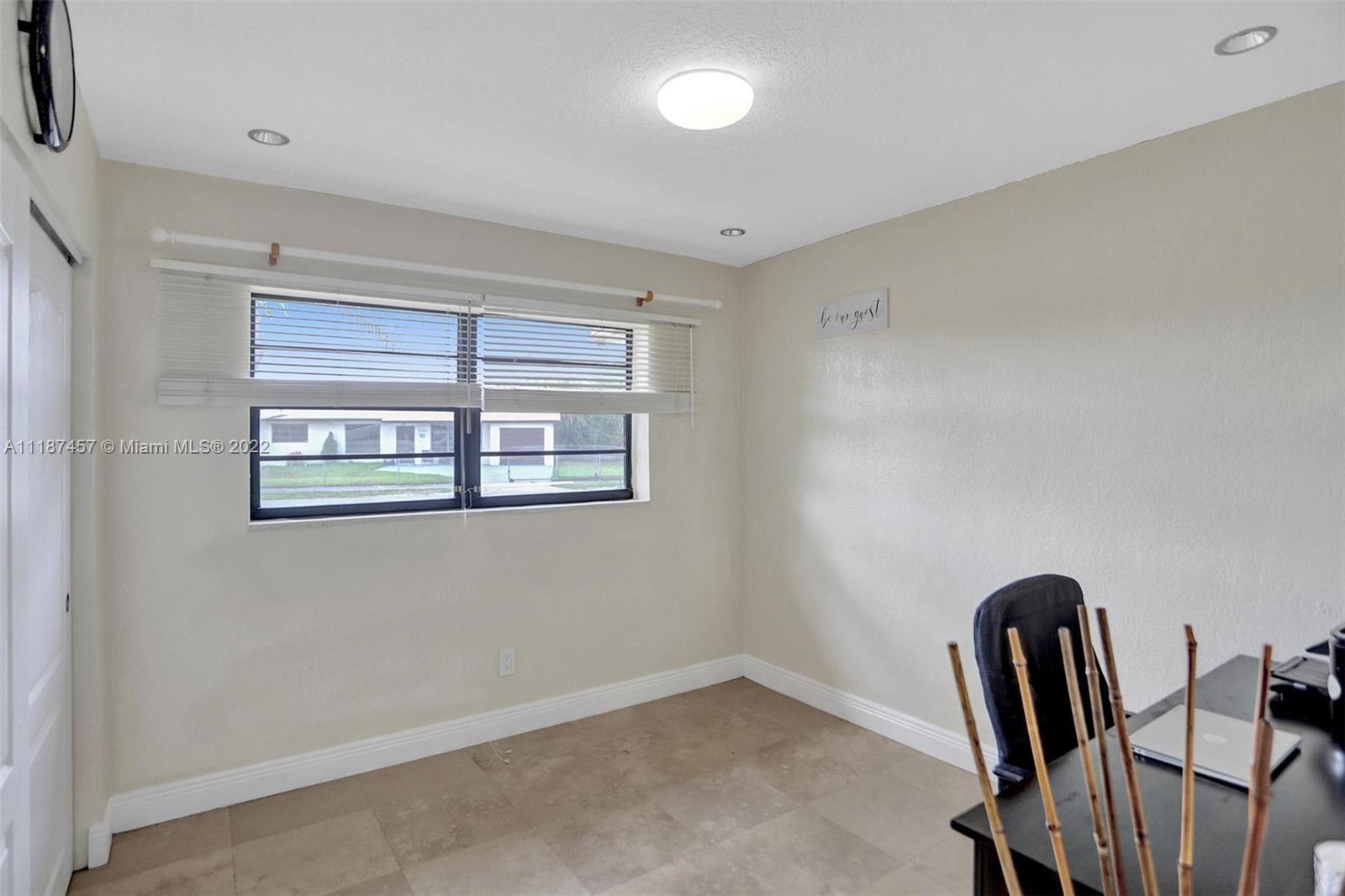 10401 Southwest 53rd Street Miami, FL 33165 - Photo 49 of 53 a view of livingroom with workspace and windows