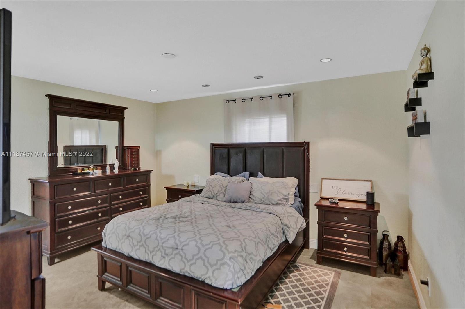 10401 Southwest 53rd Street Miami, FL 33165 - Photo 5 of 53 a bedroom with a bed and a dresser