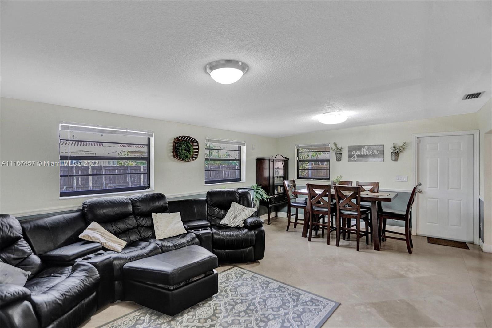 10401 Southwest 53rd Street Miami, FL 33165 - Photo 7 of 53 a living room with furniture and wooden floor