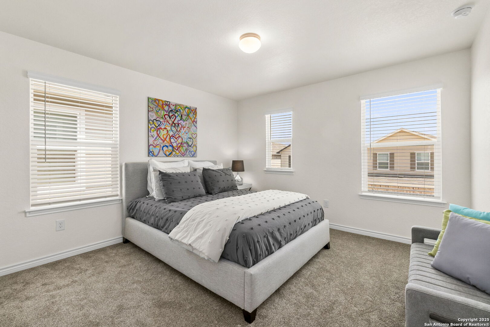 14839 Vance Jackson Road, Unit 1101 San Antonio, TX 78249 - Photo 16 of 31 a spacious bedroom with a bed and a window