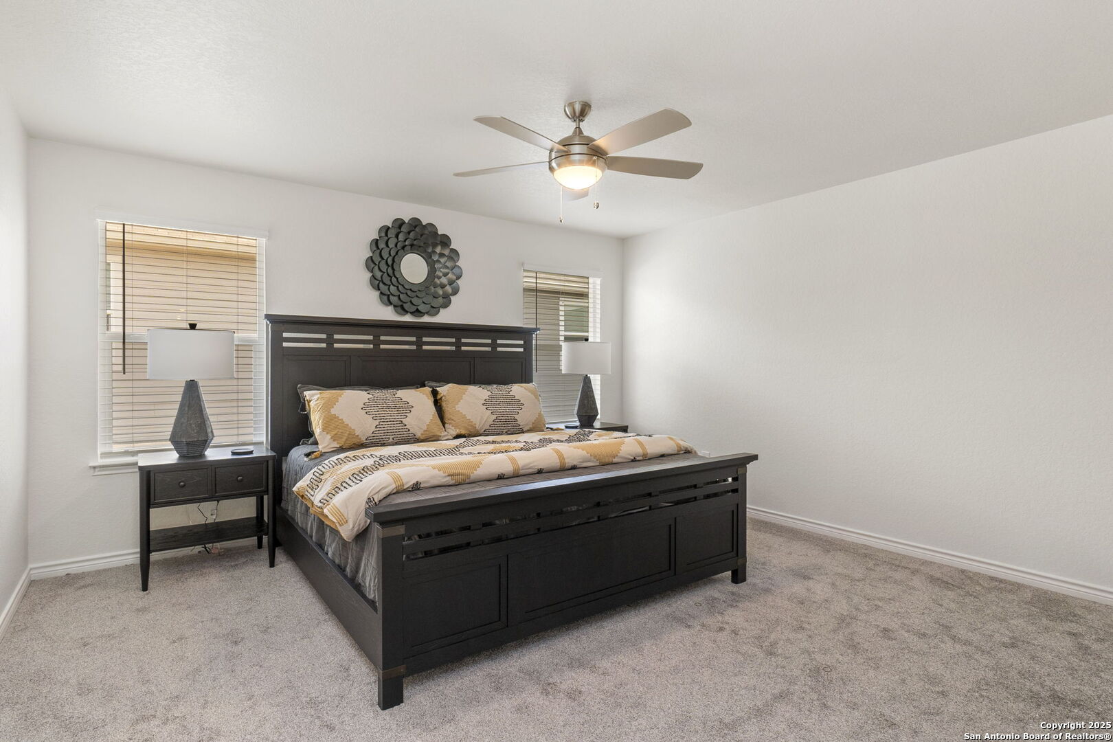 14839 Vance Jackson Road, Unit 1101 San Antonio, TX 78249 - Photo 22 of 31 a bedroom with a bed and a chandelier