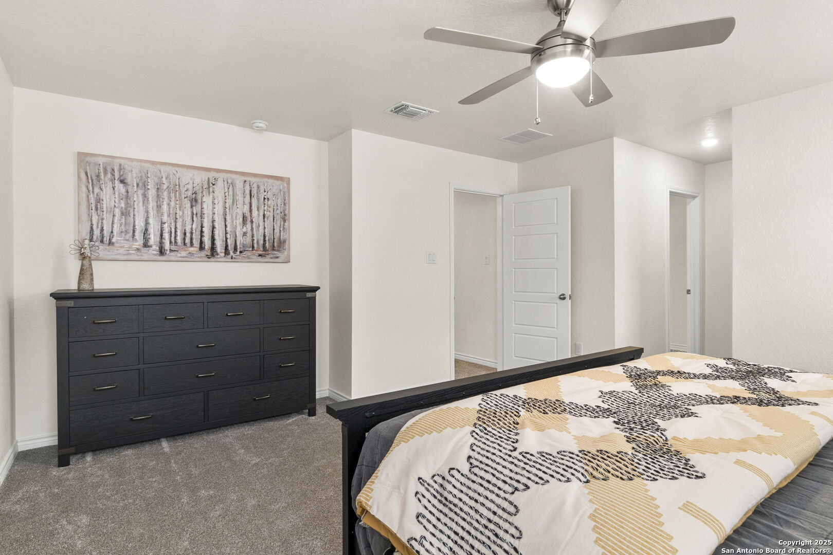 14839 Vance Jackson Road, Unit 1101 San Antonio, TX 78249 - Photo 23 of 31 a bedroom with a large bed and a window