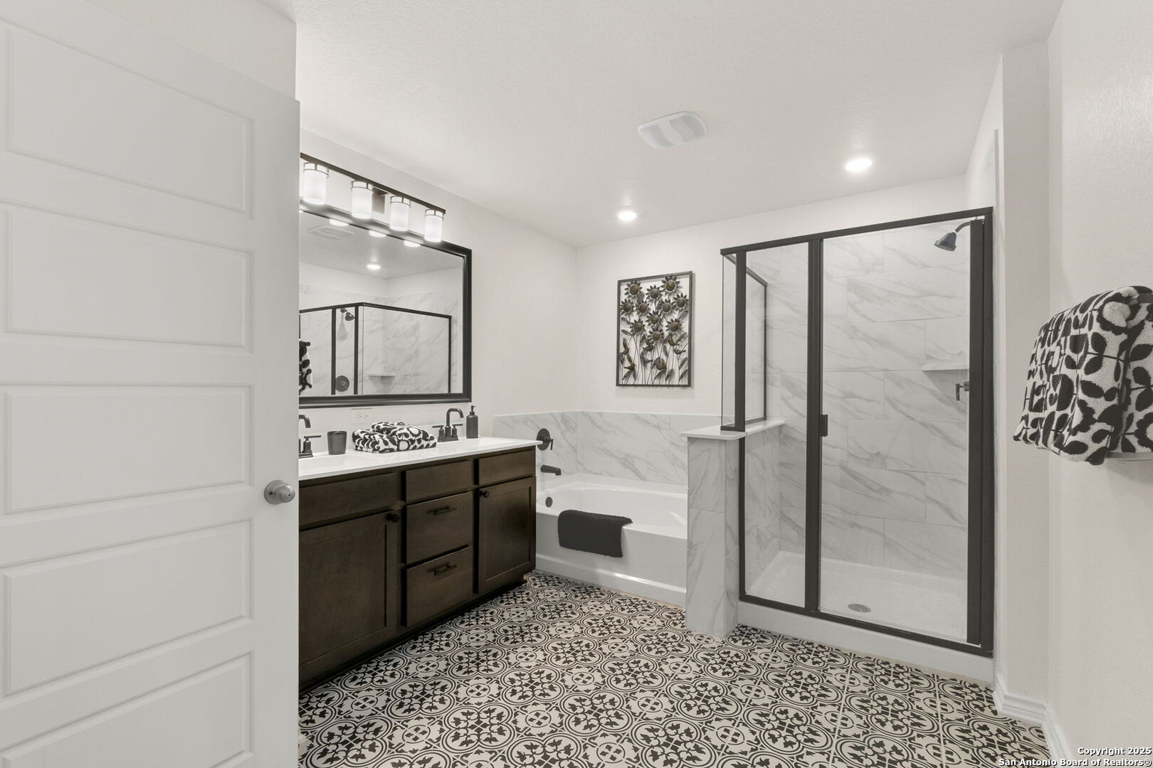 14839 Vance Jackson Road, Unit 1101 San Antonio, TX 78249 - Photo 26 of 31 a bathroom with a shower and a sink