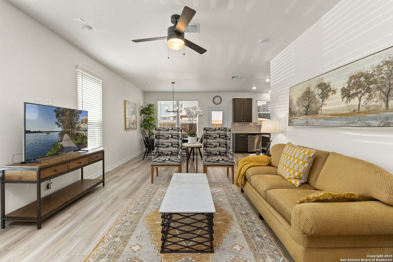 14839 Vance Jackson Road, Unit 1101 San Antonio, TX 78249 - Photo 6 of 31 a living room with furniture and a flat screen tv