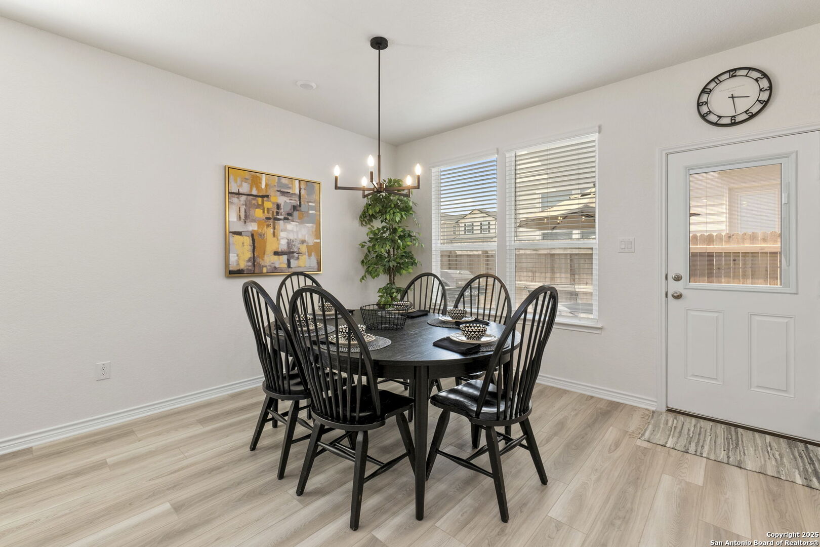 14839 Vance Jackson Road, Unit 1101 San Antonio, TX 78249 - Photo 7 of 31 a view of a dining room with furniture window and wooden floor