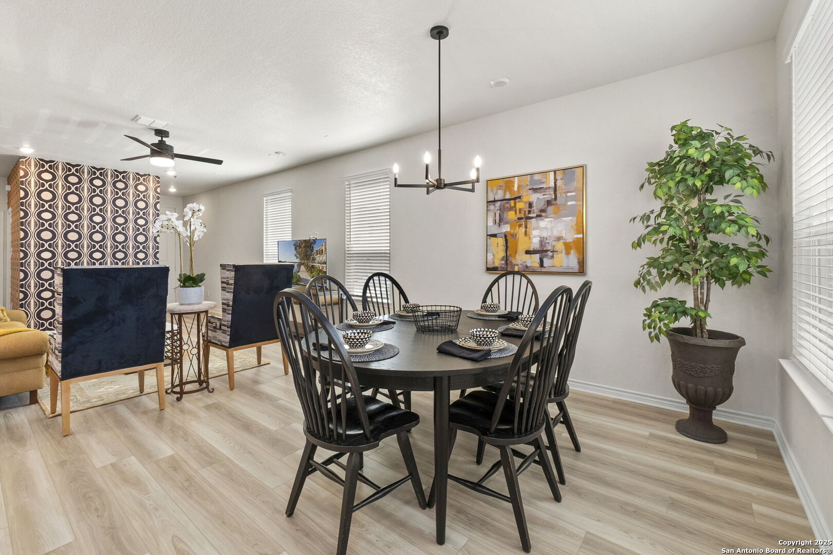 14839 Vance Jackson Road, Unit 1101 San Antonio, TX 78249 - Photo 8 of 31 a view of a dining room with furniture and wooden floor