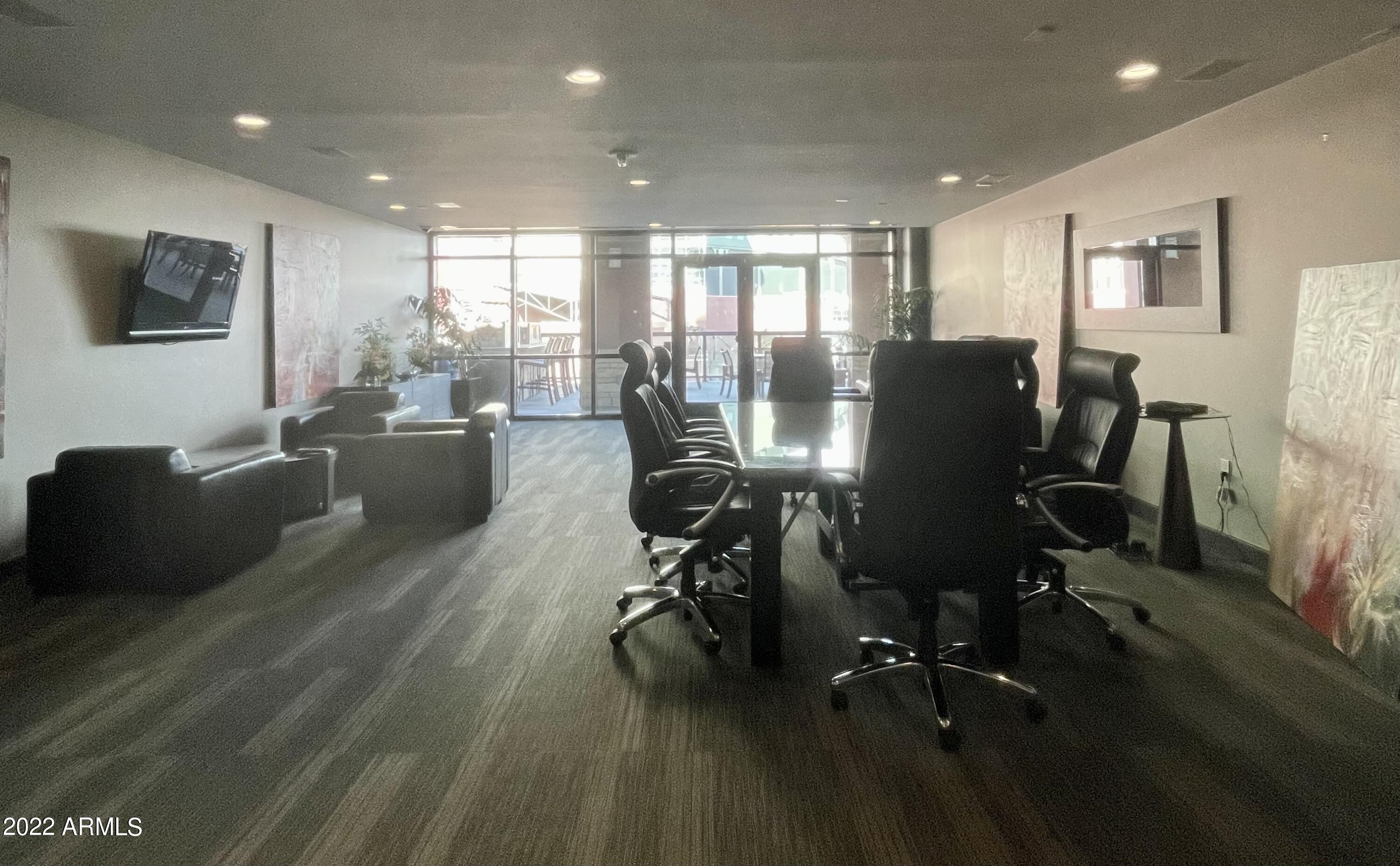 310 South 4th Street, Unit 1507 Phoenix, AZ 85004 - Photo 7 of 24 a view of a workspace with furniture and wooden floor