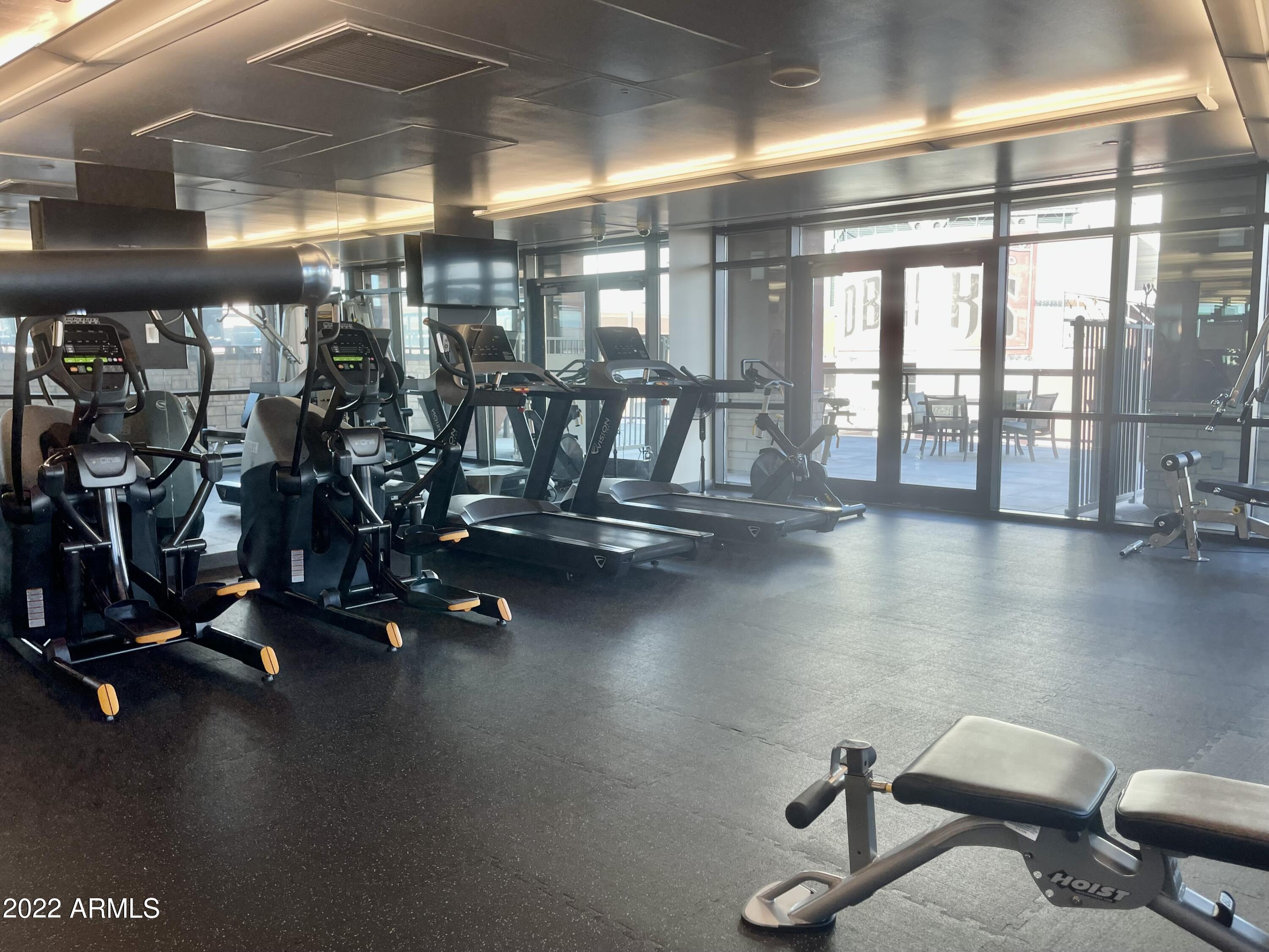 310 South 4th Street, Unit 1507 Phoenix, AZ 85004 - Photo 9 of 24 a view of a room with gym equipment