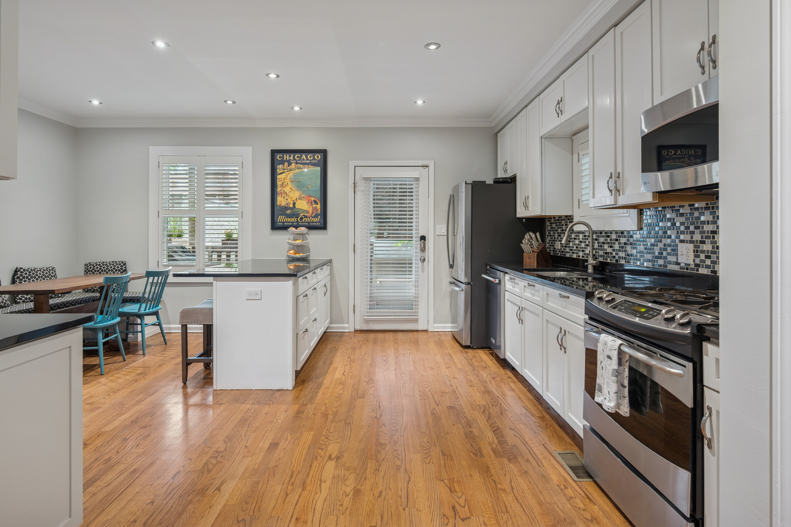 1329 North Mohawk Street, Unit 1 Chicago, IL 60610 - Photo 6 of 25 a kitchen with a sink stove and cabinets