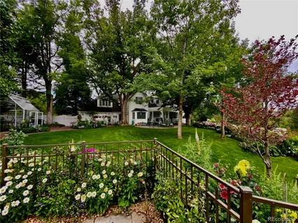 a view of a house with a big yard next to a yard