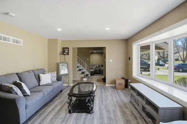 a living room with furniture and a large window