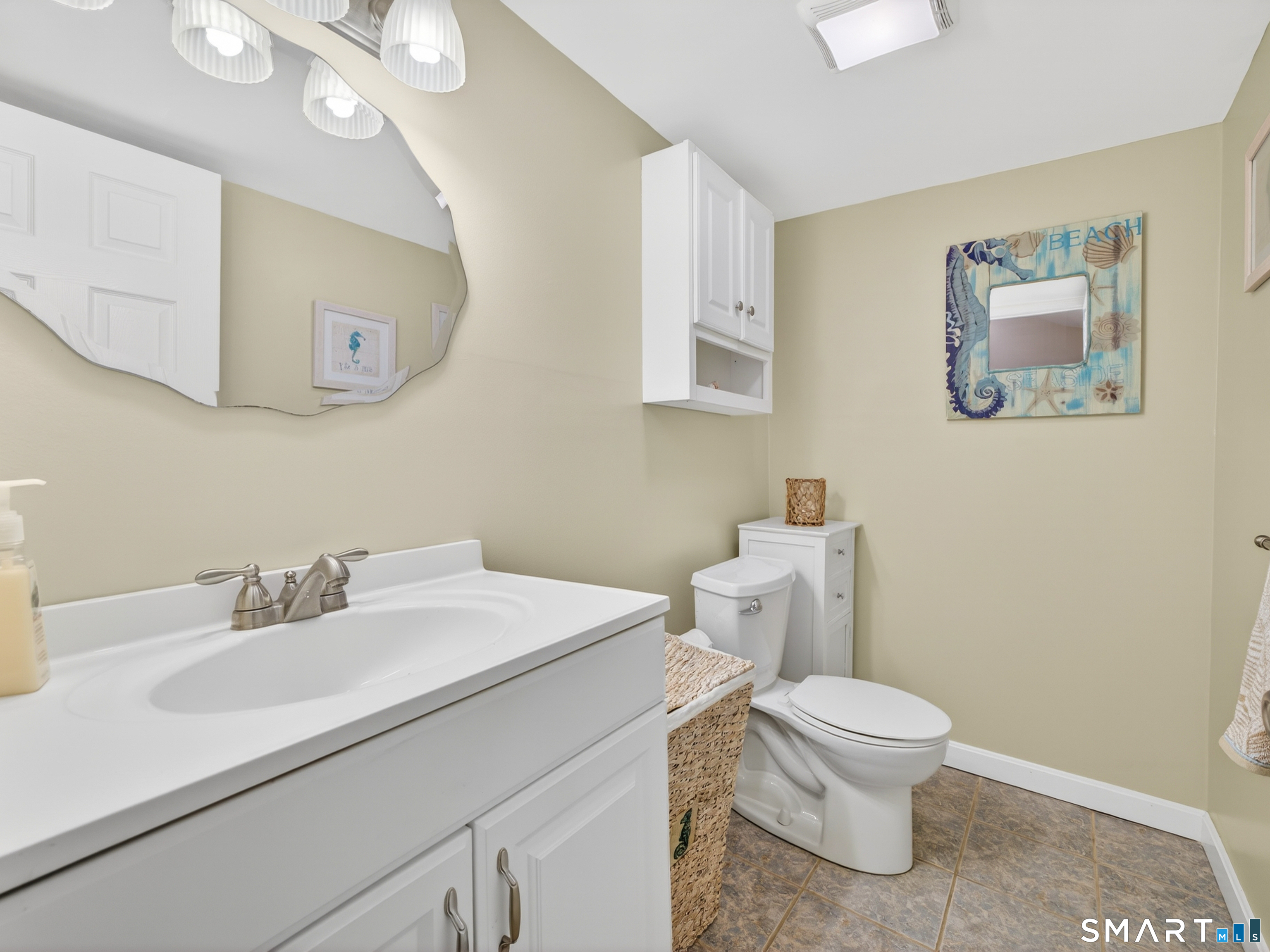 31 Old Colony Road Old Lyme, CT 06371 - Photo 16 of 38 a white toilet sitting next to a bathroom sink