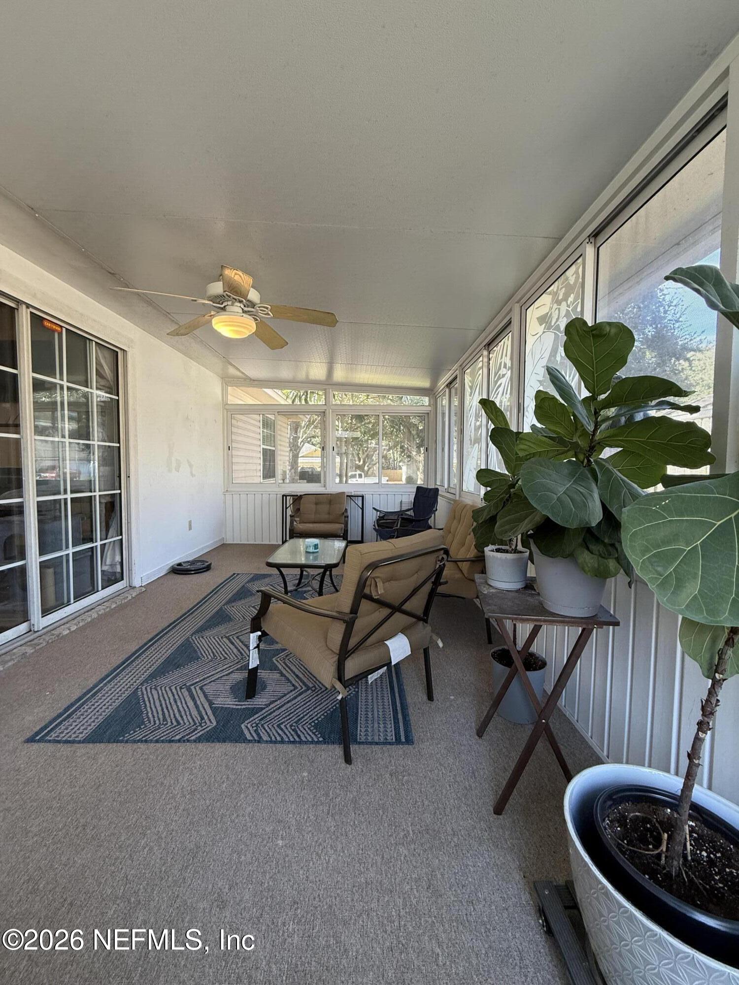12579 Fish Hawk Lane Jacksonville, FL 32225 - Photo 11 of 11 a living room with furniture and a potted plant