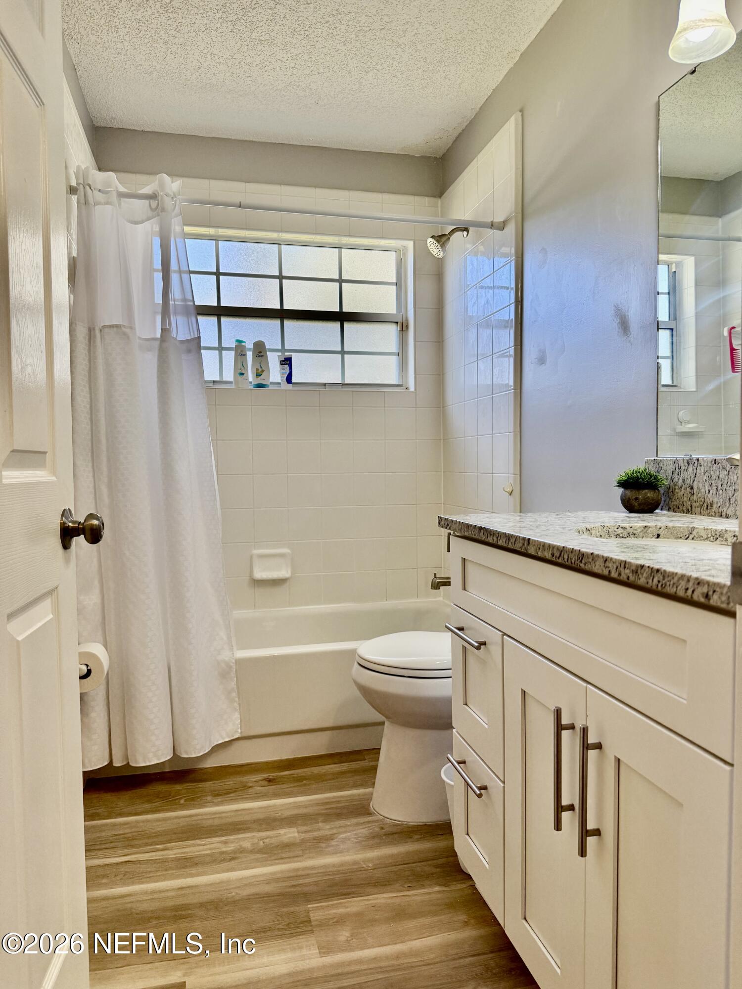 12579 Fish Hawk Lane Jacksonville, FL 32225 - Photo 9 of 11 a bathroom with a toilet sink and a mirror