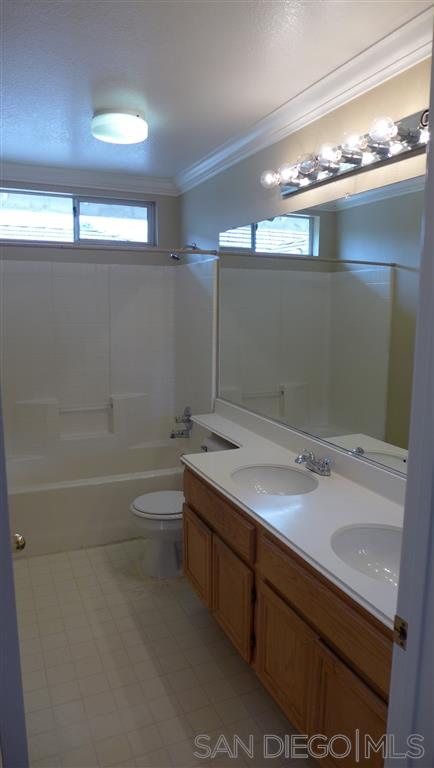 2352 Eastridge Loop Chula Vista, CA 91915 - Photo 20 of 21 a bathroom with a sink and a mirror