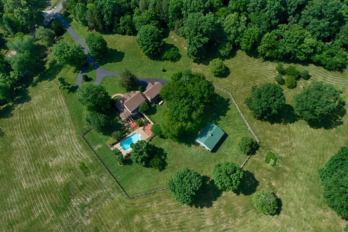 205 Puryear Road Pulaski, TN 38478 - Photo 3 of 36 an aerial view of residential house with outdoor space and trees all around