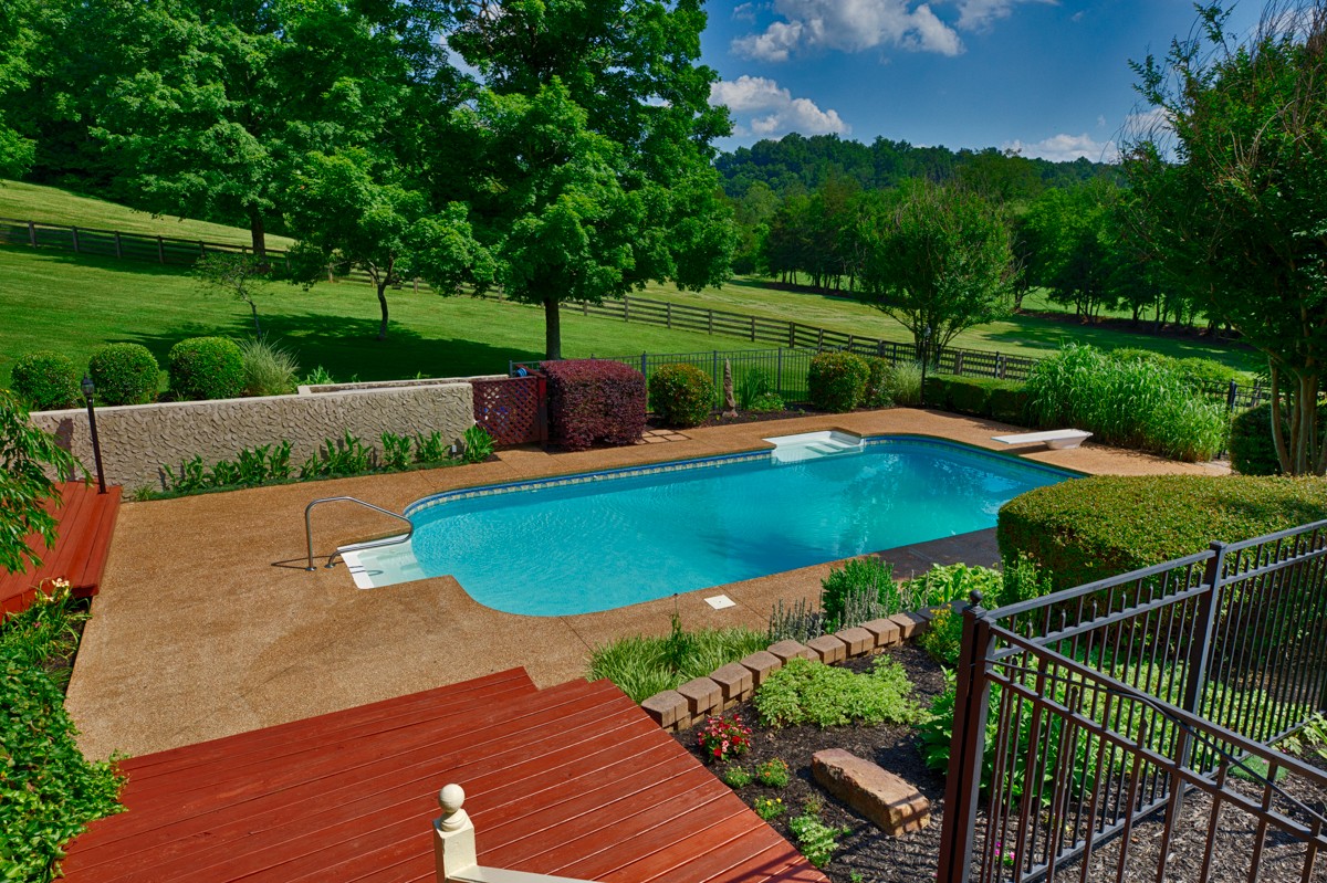 205 Puryear Road Pulaski, TN 38478 - Photo 22 of 36 a view of a backyard with swimming pool and green space