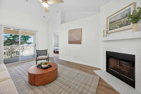 a living room with furniture a lamp and a fireplace