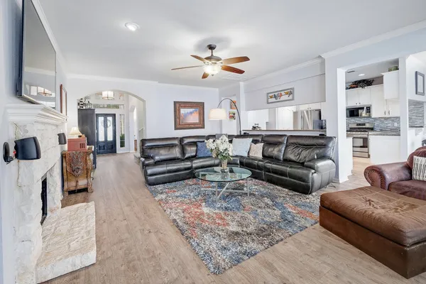 a living room with furniture and a fireplace