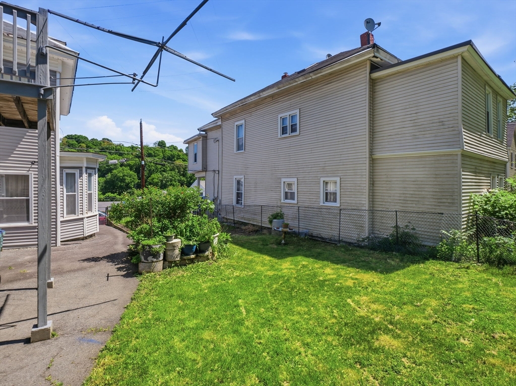 223 Stackpole Street Lowell, MA 01852 - Photo 39 of 42 a view of a back yard of the house