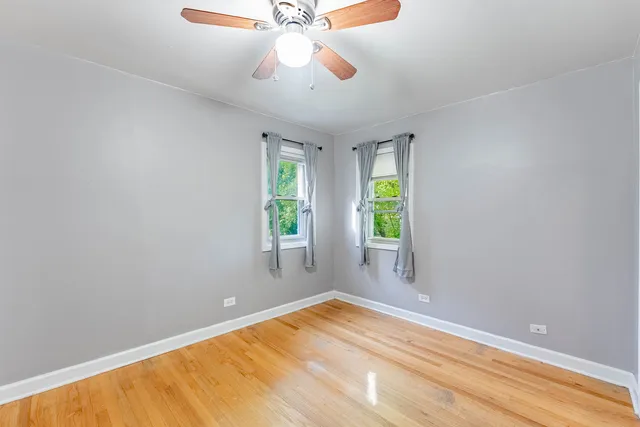 a view of room with window and ceiling fan