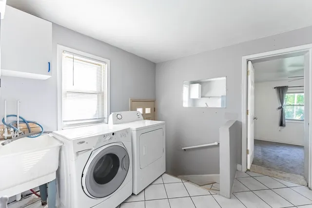 a view of a room with washer and dryer