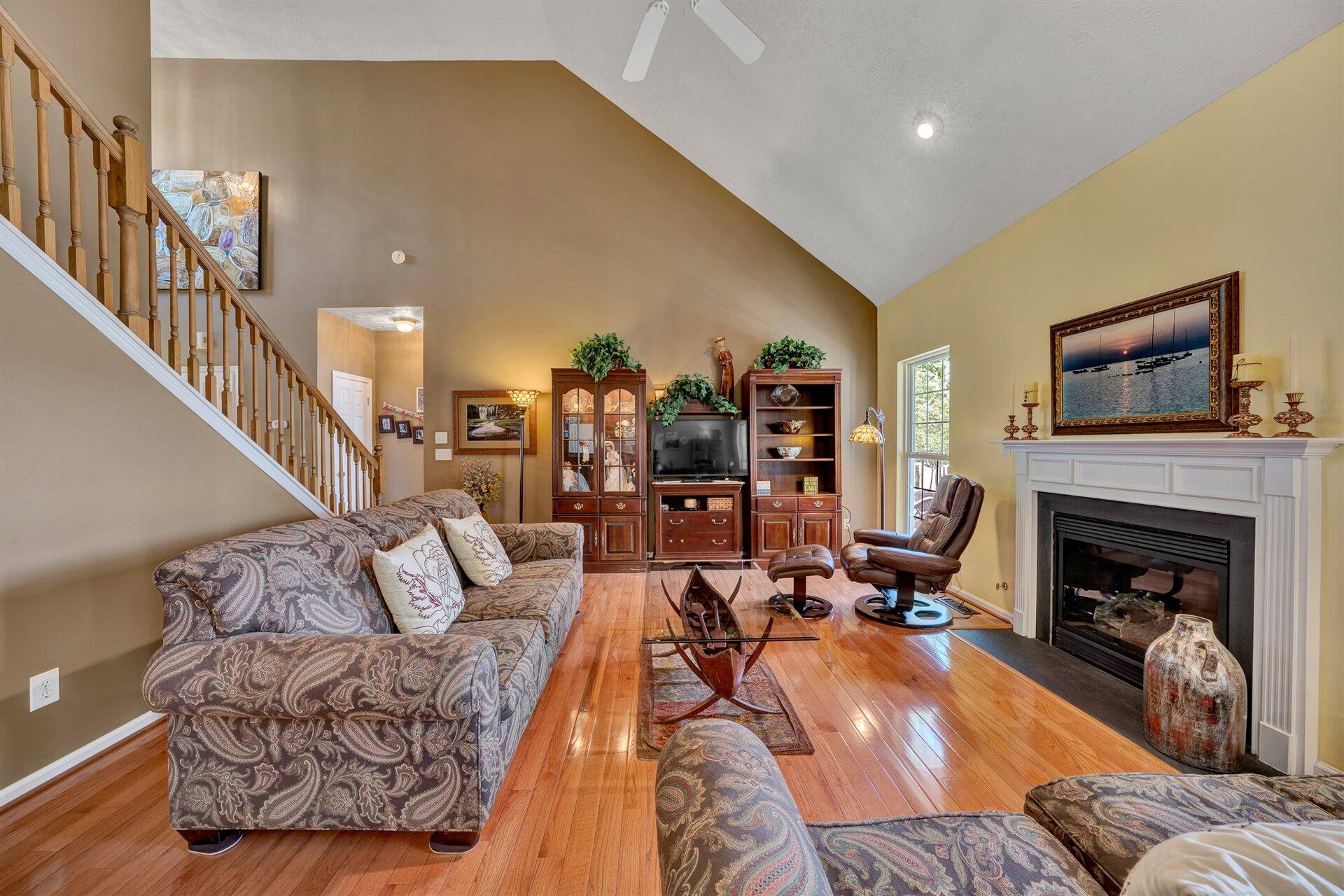 11 Cedar Bay Road Union Hall, VA 24176 - Photo 11 of 60 a living room with furniture large window and a fireplace