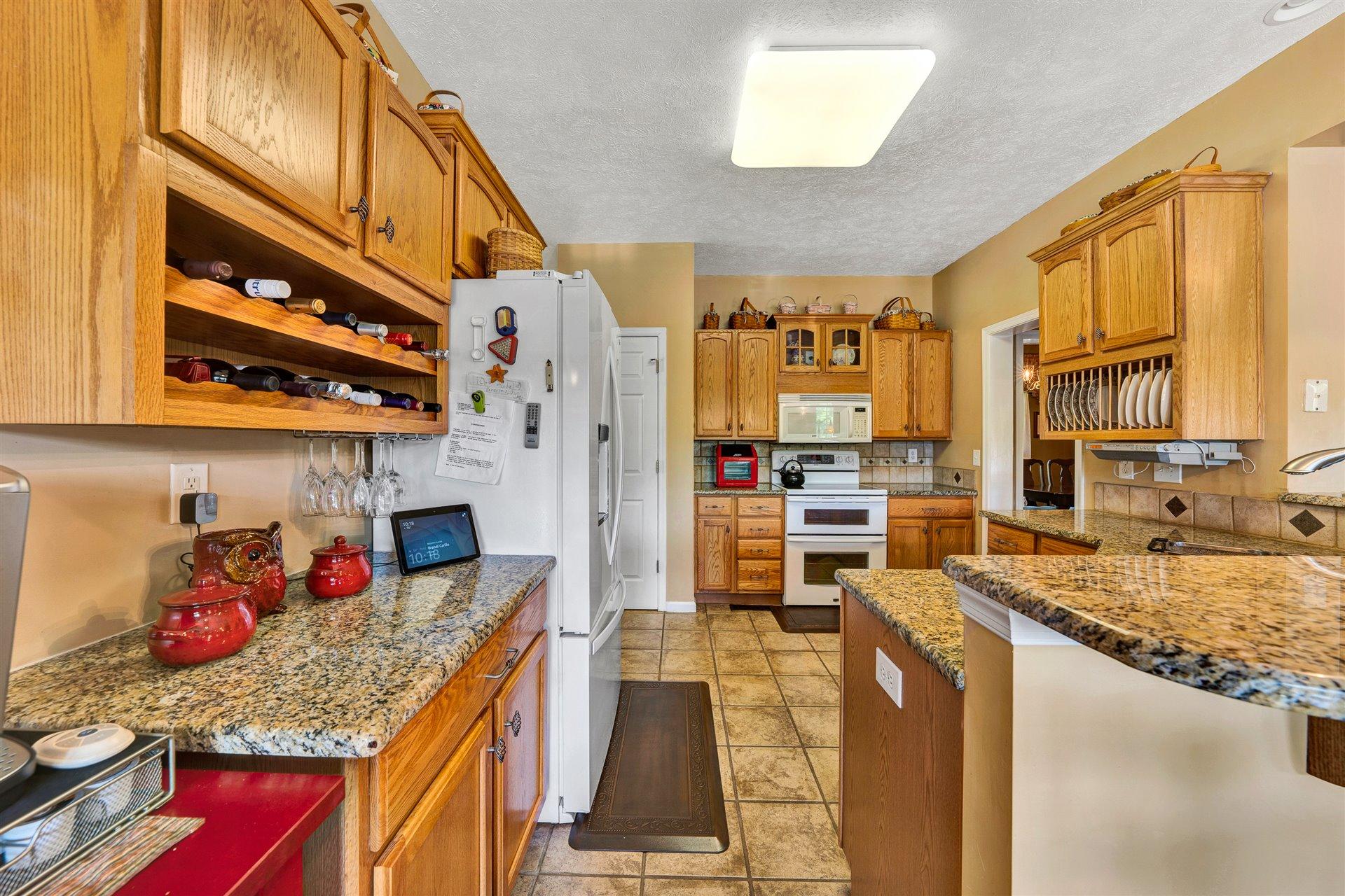 11 Cedar Bay Road Union Hall, VA 24176 - Photo 15 of 60 a kitchen with stainless steel appliances granite countertop a stove and a refrigerator