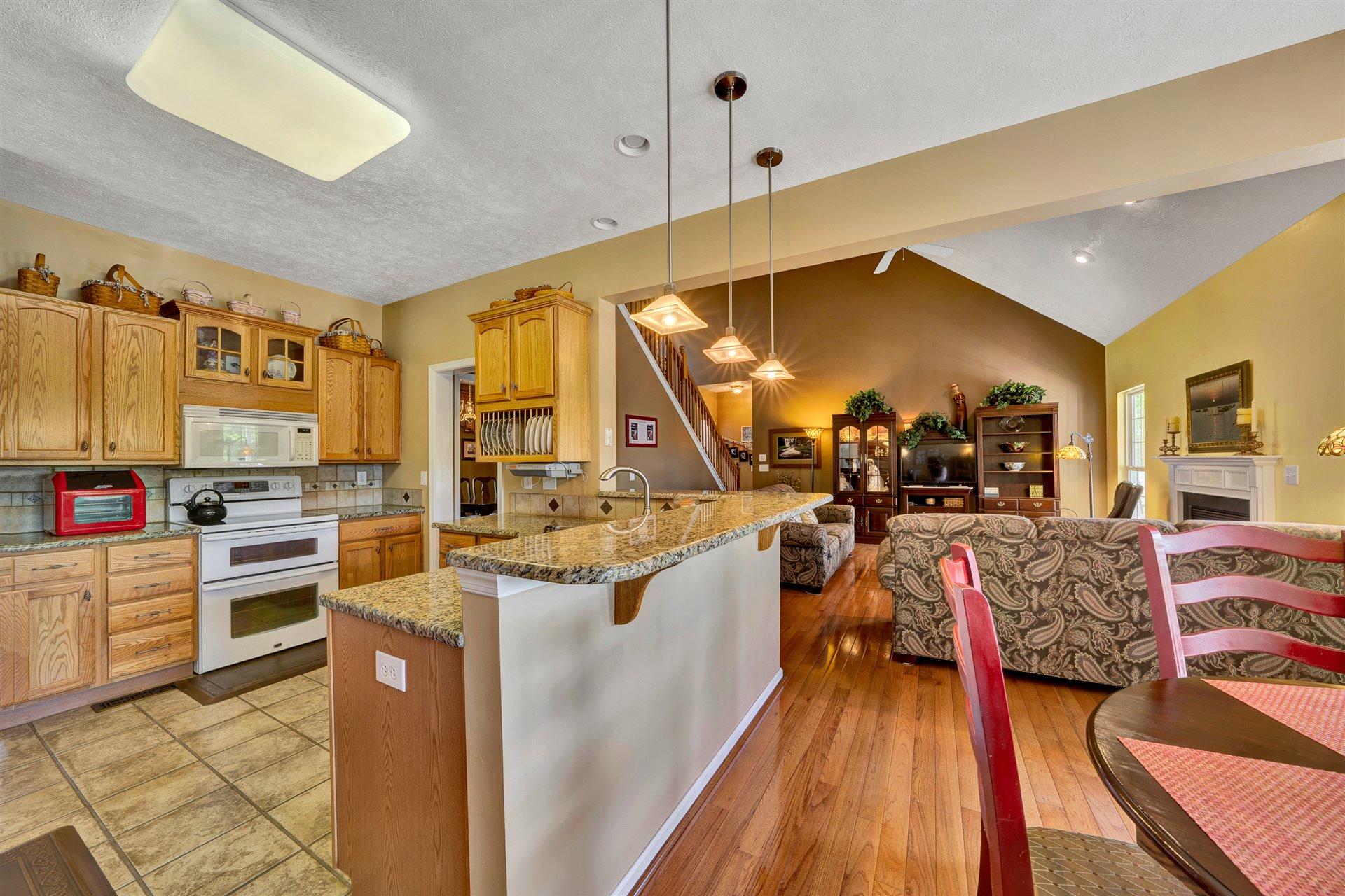 11 Cedar Bay Road Union Hall, VA 24176 - Photo 16 of 60 a view of a kitchen with kitchen island stainless steel appliances wooden floor and furniture
