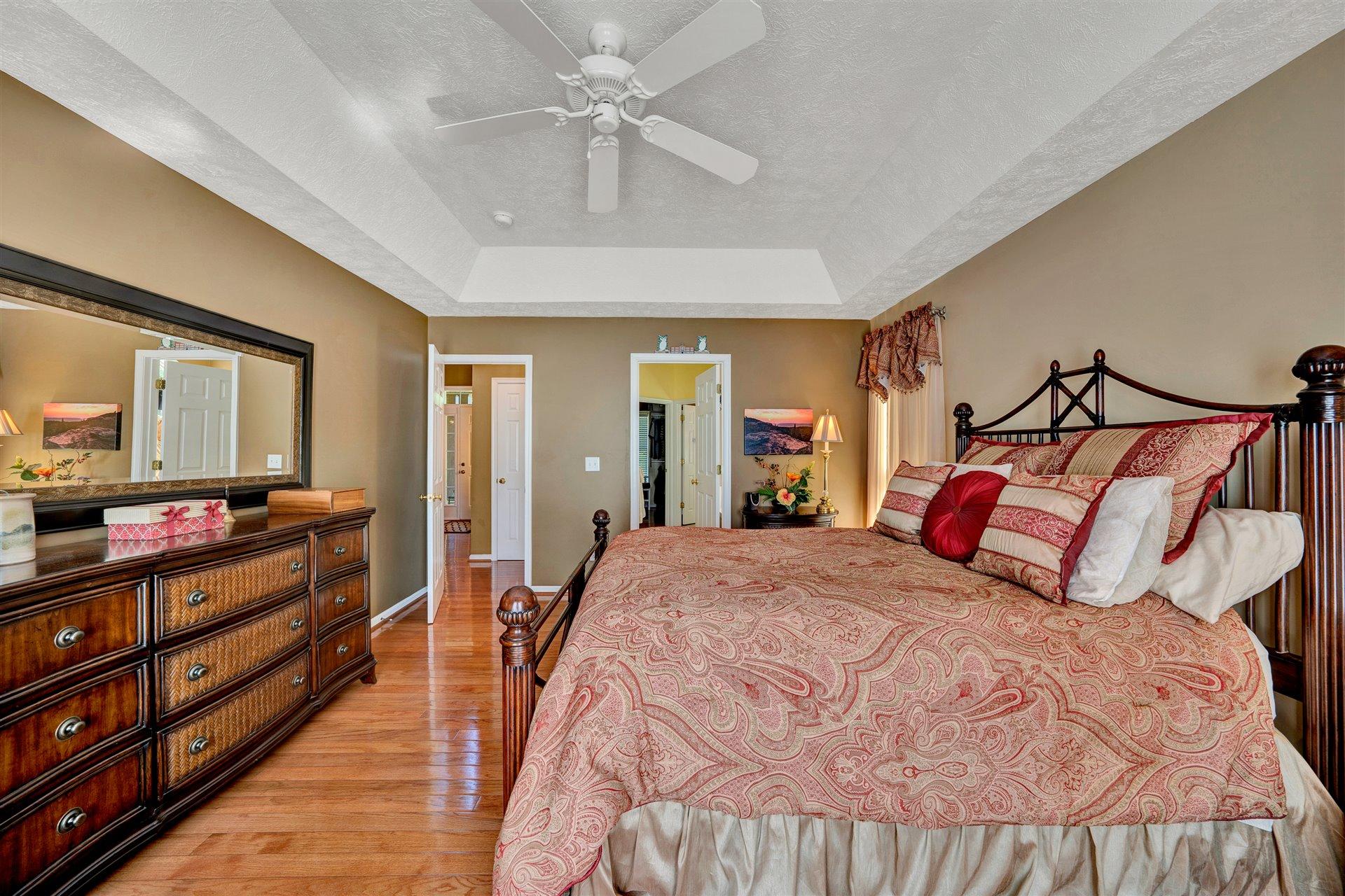 11 Cedar Bay Road Union Hall, VA 24176 - Photo 26 of 60 a bedroom with a bed and a chandelier
