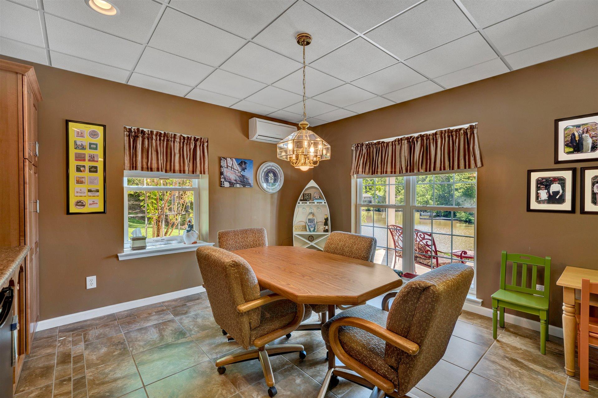 11 Cedar Bay Road Union Hall, VA 24176 - Photo 41 of 60 a dining room with furniture a chandelier and window