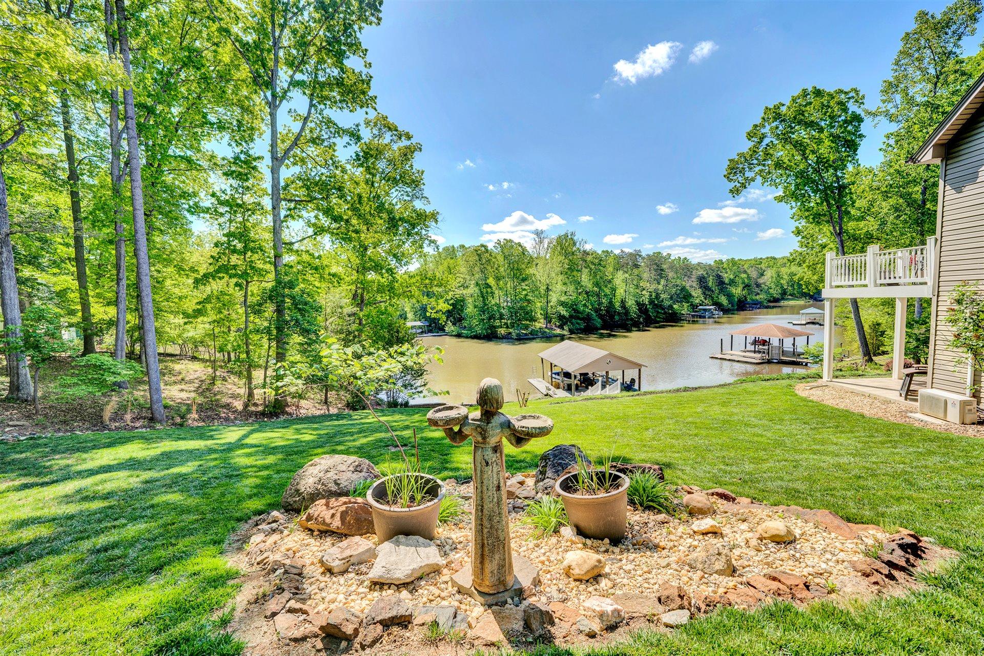11 Cedar Bay Road Union Hall, VA 24176 - Photo 48 of 60 a view of a garden with potted plants and large trees