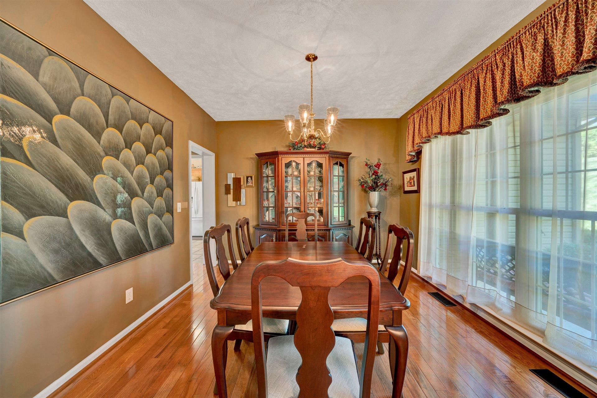 11 Cedar Bay Road Union Hall, VA 24176 - Photo 6 of 60 a view of a dining room with furniture window and outside view