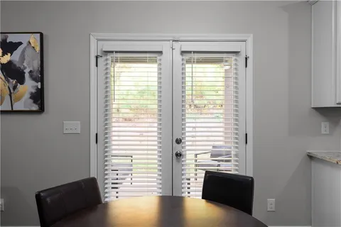 a view of room with window and furniture