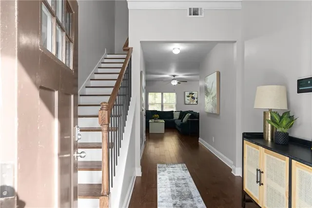 a lobby with furniture and wooden floor