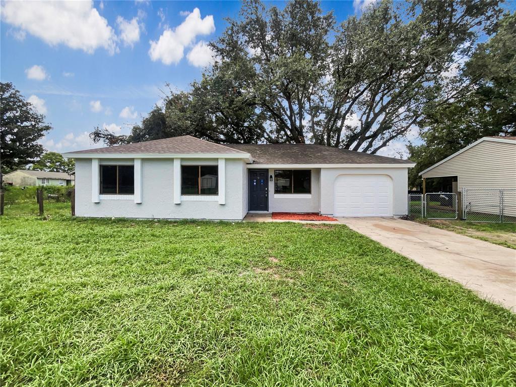 9 Spring Loop Circle Ocala, FL 34472 - Photo 1 of 1 a front view of house with yard and green space