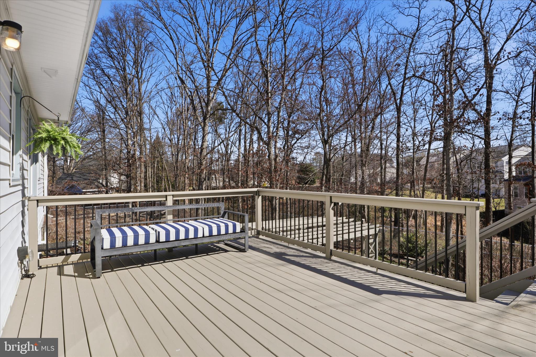 8109 Overton Court Springfield, VA 22153 - Photo 13 of 38 a view of balcony with wooden floor and fence
