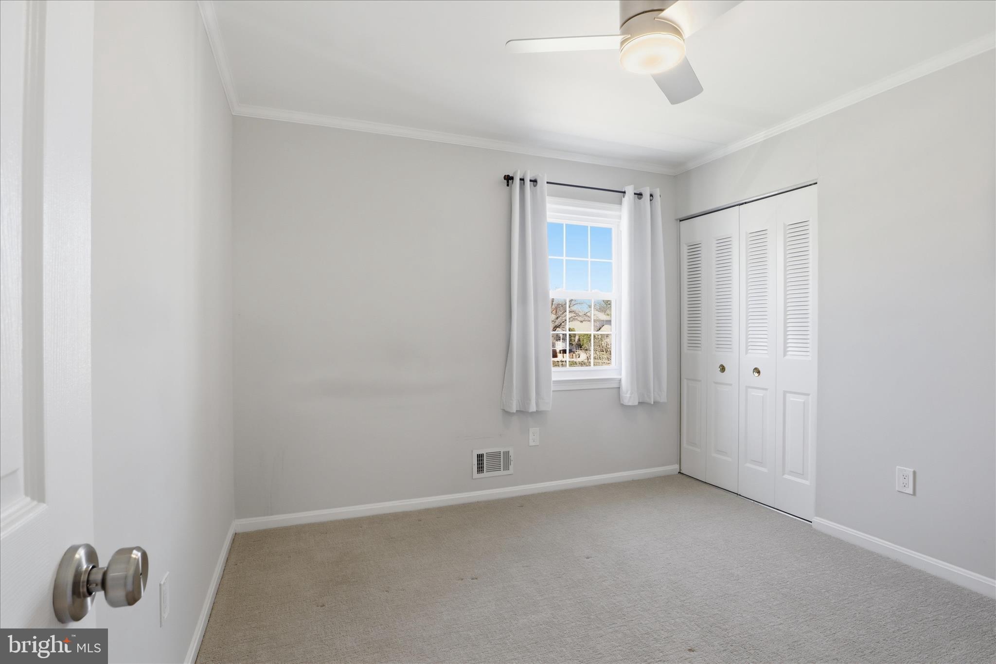8109 Overton Court Springfield, VA 22153 - Photo 21 of 38 a view of an empty room with a window
