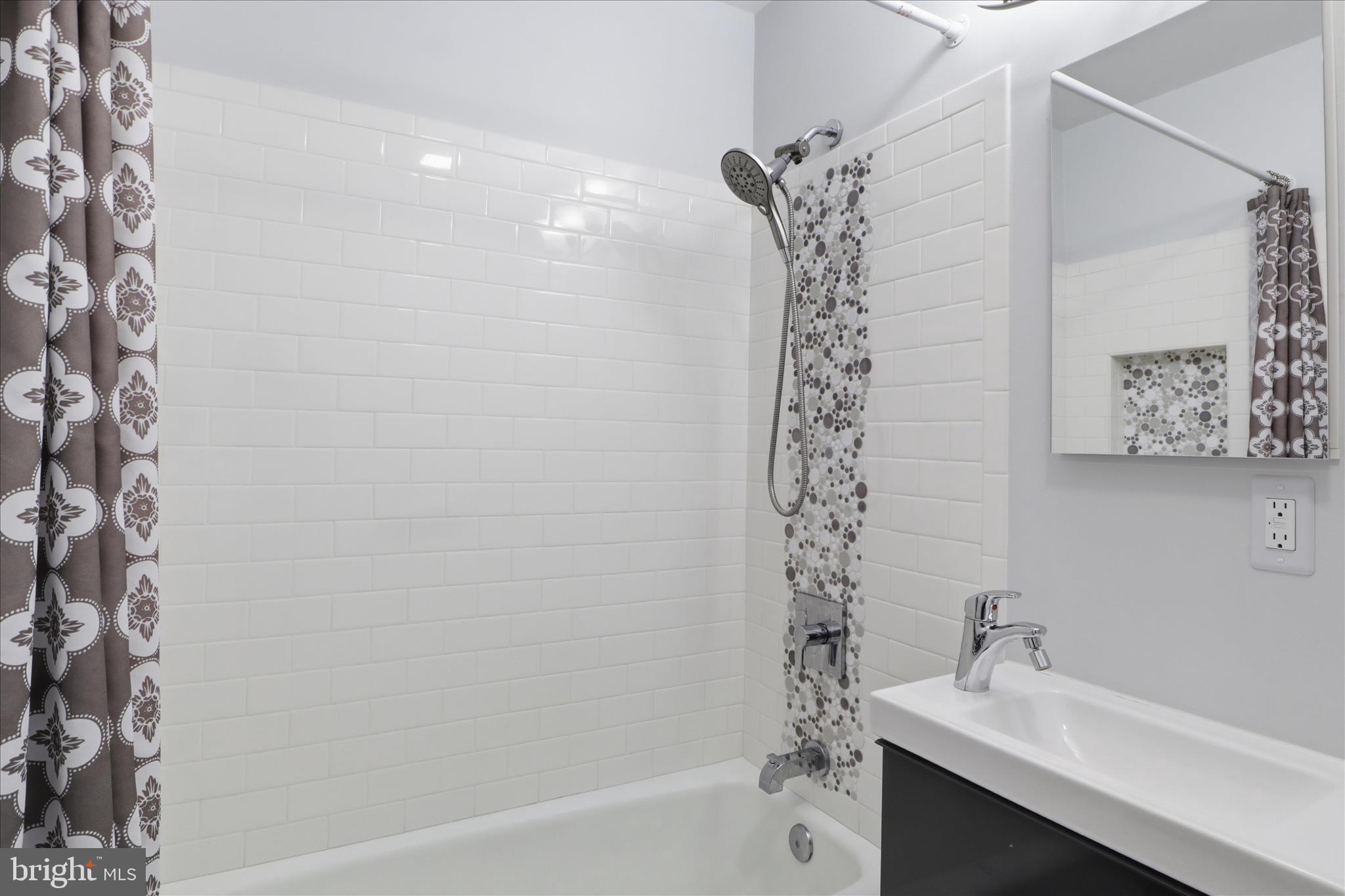 8109 Overton Court Springfield, VA 22153 - Photo 24 of 38 a bathroom with a bathtub a sink and a shower