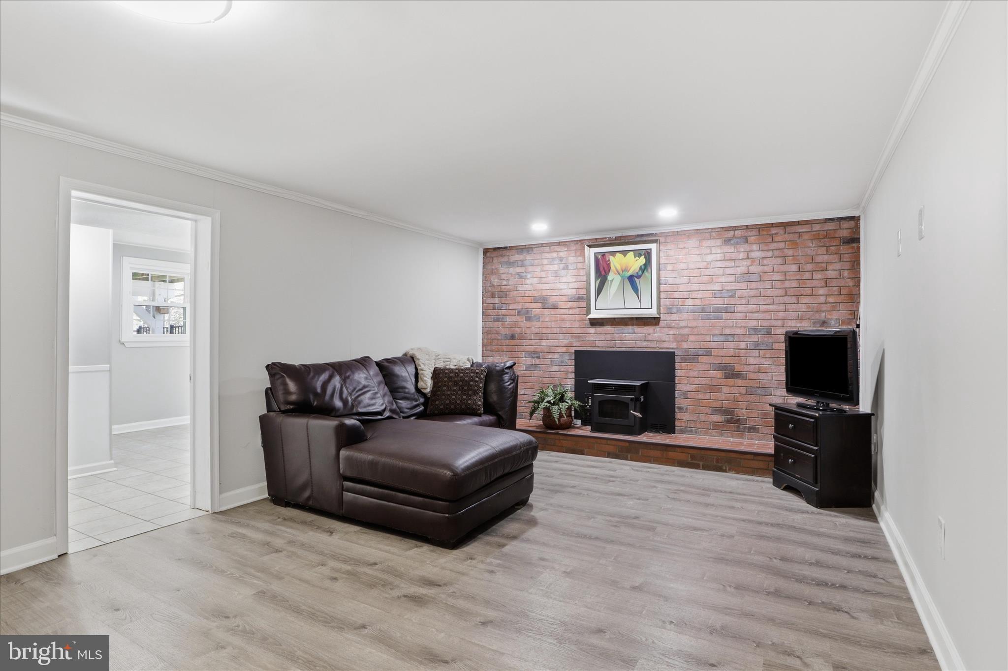 8109 Overton Court Springfield, VA 22153 - Photo 25 of 38 a living room with furniture and a fireplace