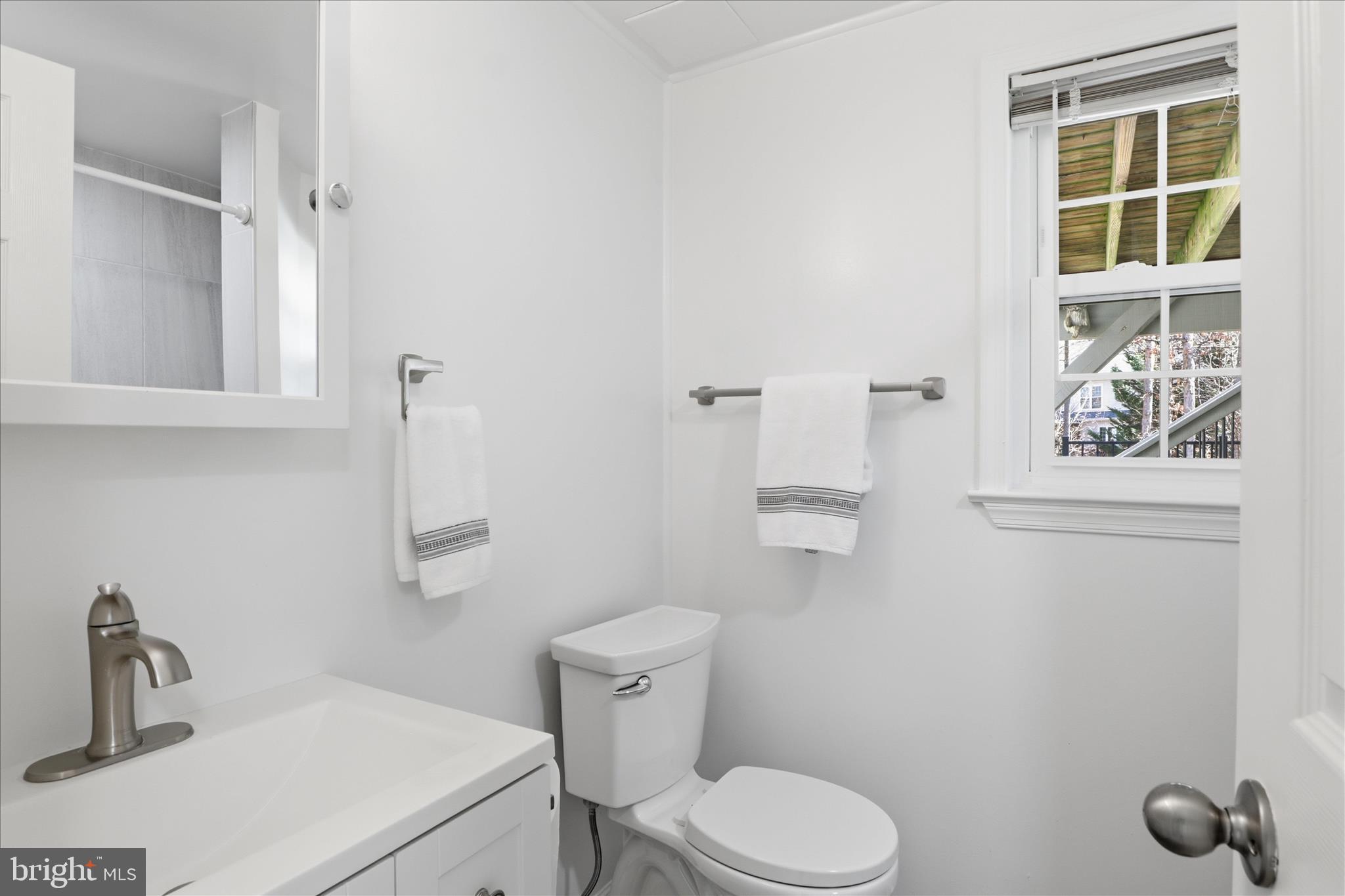 8109 Overton Court Springfield, VA 22153 - Photo 28 of 38 a bathroom with a toilet sink and window