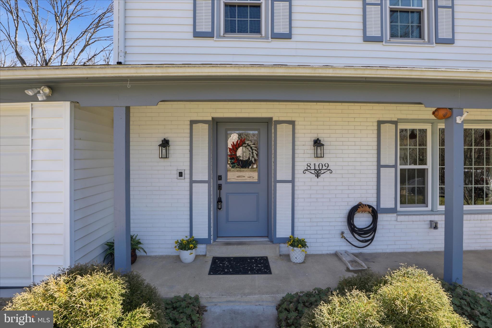 8109 Overton Court Springfield, VA 22153 - Photo 4 of 38 a front view of a house with a yard
