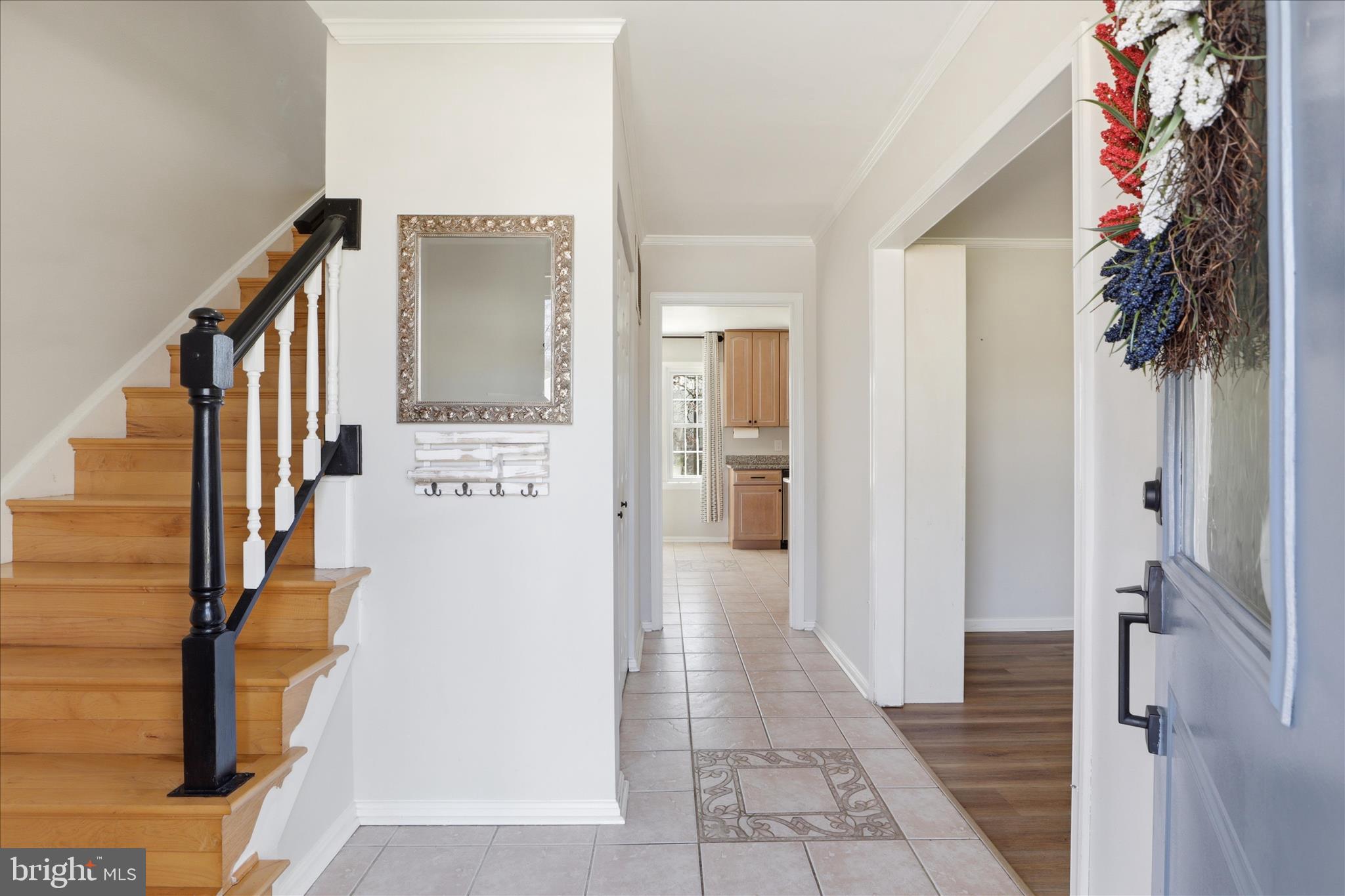 8109 Overton Court Springfield, VA 22153 - Photo 5 of 38 a view of a hallway with a white walls and stairs