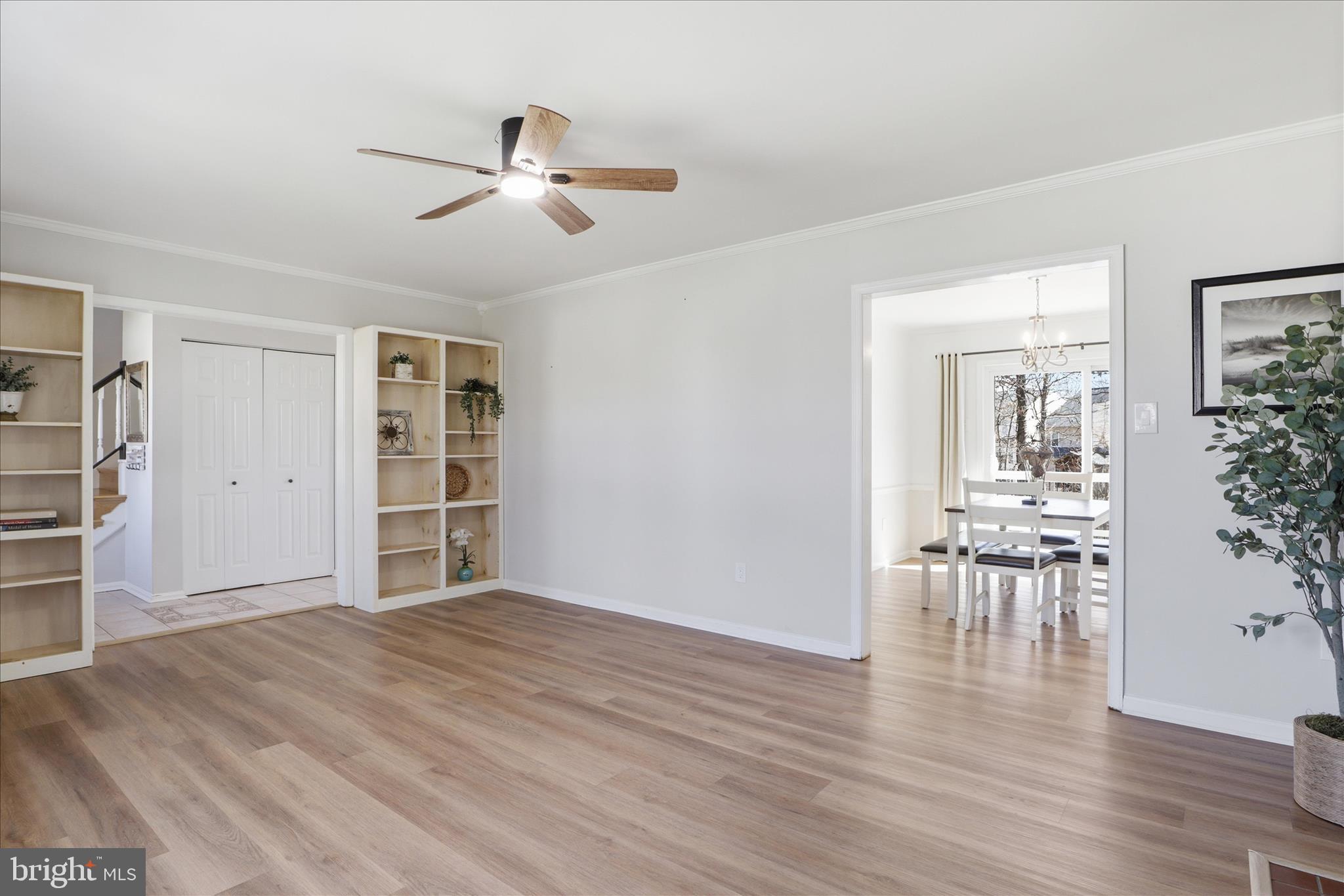 8109 Overton Court Springfield, VA 22153 - Photo 6 of 38 a view of empty room with wooden floor and ceiling fan