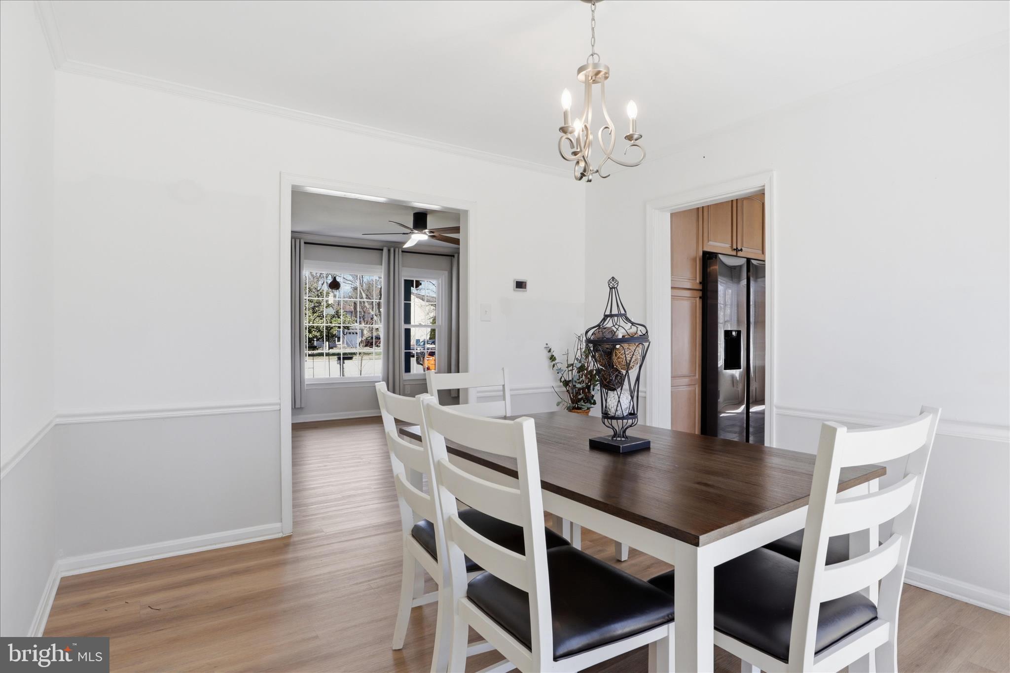 8109 Overton Court Springfield, VA 22153 - Photo 8 of 38 a view of a dining room with furniture and wooden floor