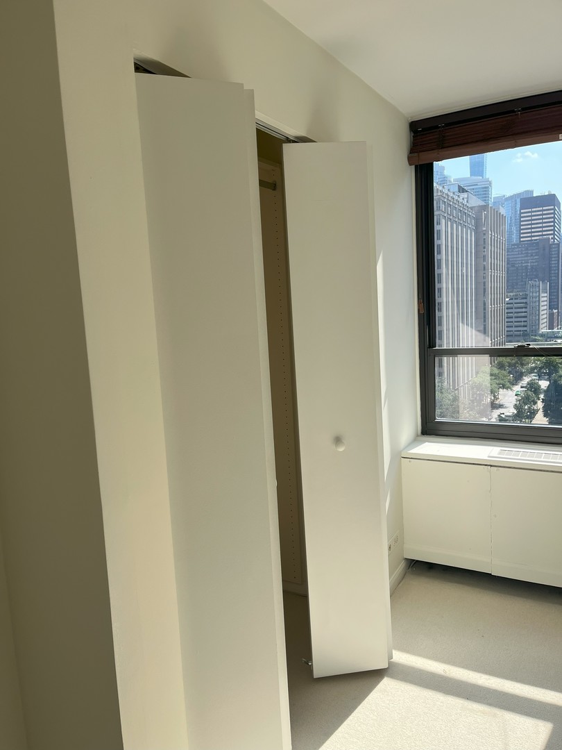 222 East Pearson Street, Unit 1406 Chicago, IL 60611 - Photo 20 of 30 a view of bathroom with bathtub and window
