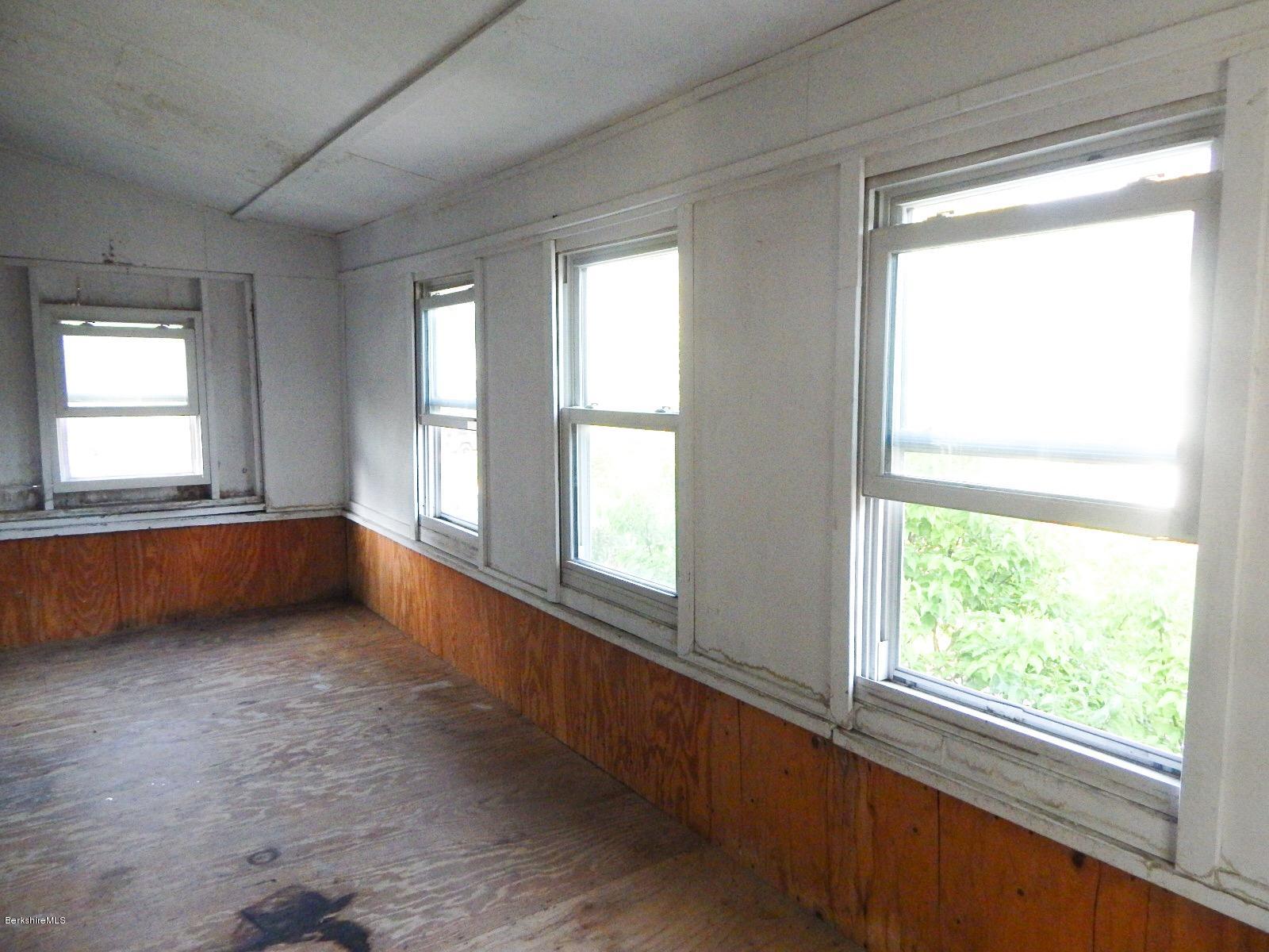15-17 Spring Street Pittsfield, MA 01201 - Photo 33 of 44 Enclosed porch on 2nd floor